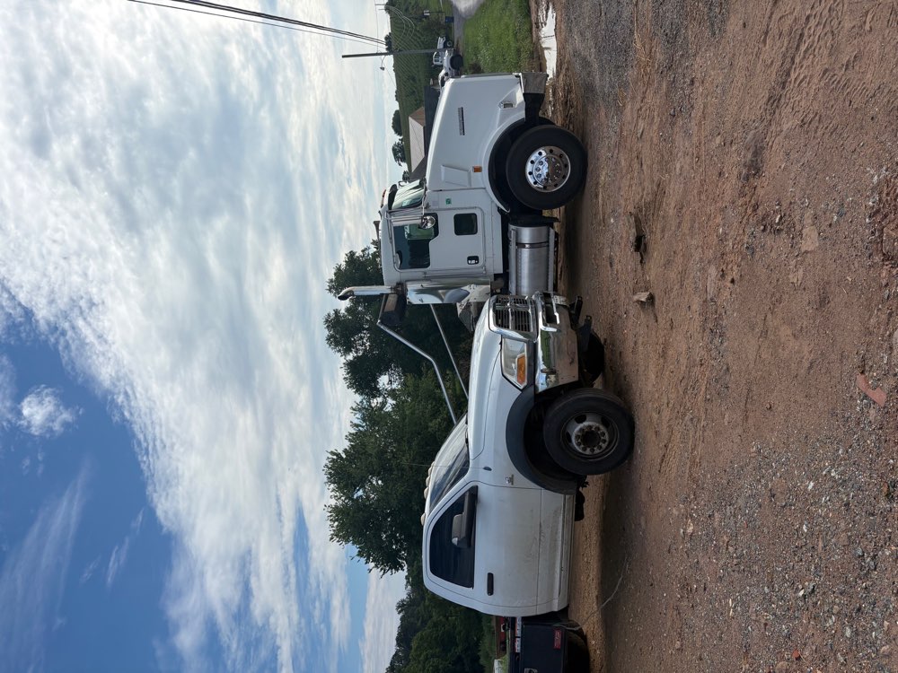Savage Waste Solutions work trucks at a local property